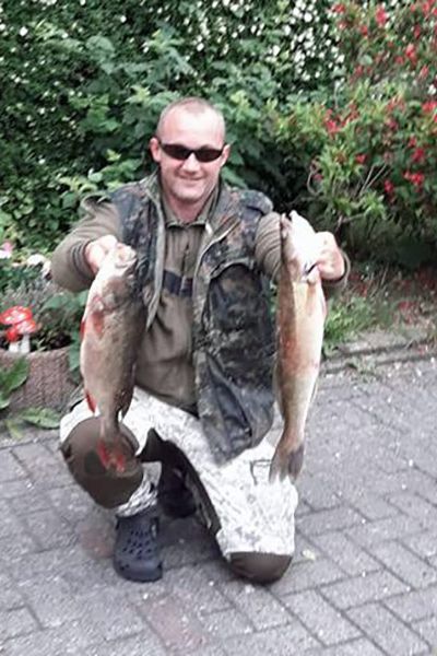 Holger Fröhlich mit Barsch und Zander